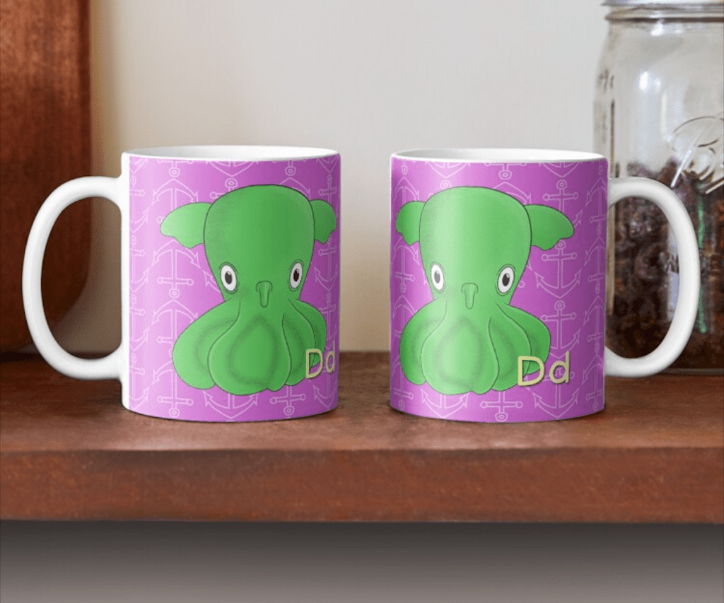 Illustrated mug featuring a cute pink Dumbo Octopus with flappy ear-like fins, part of Andy C. Marshall’s Uncommon Animals of the Alphabet series, letter D.